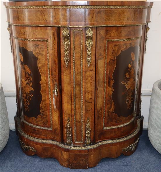 A small Victorian ormolu mounted walnut and marquetry serpentine fronted side cabinet 104cm